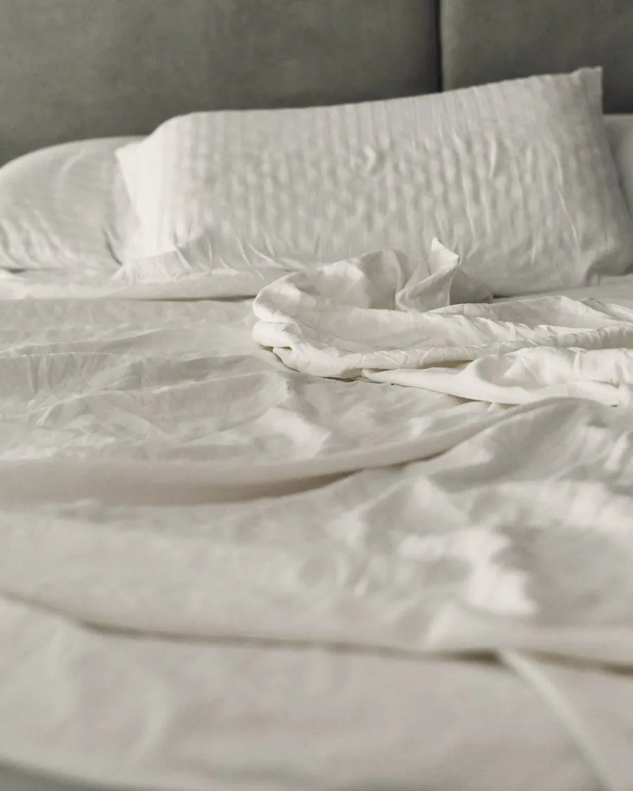 Soft cotton bed linen, side-lit