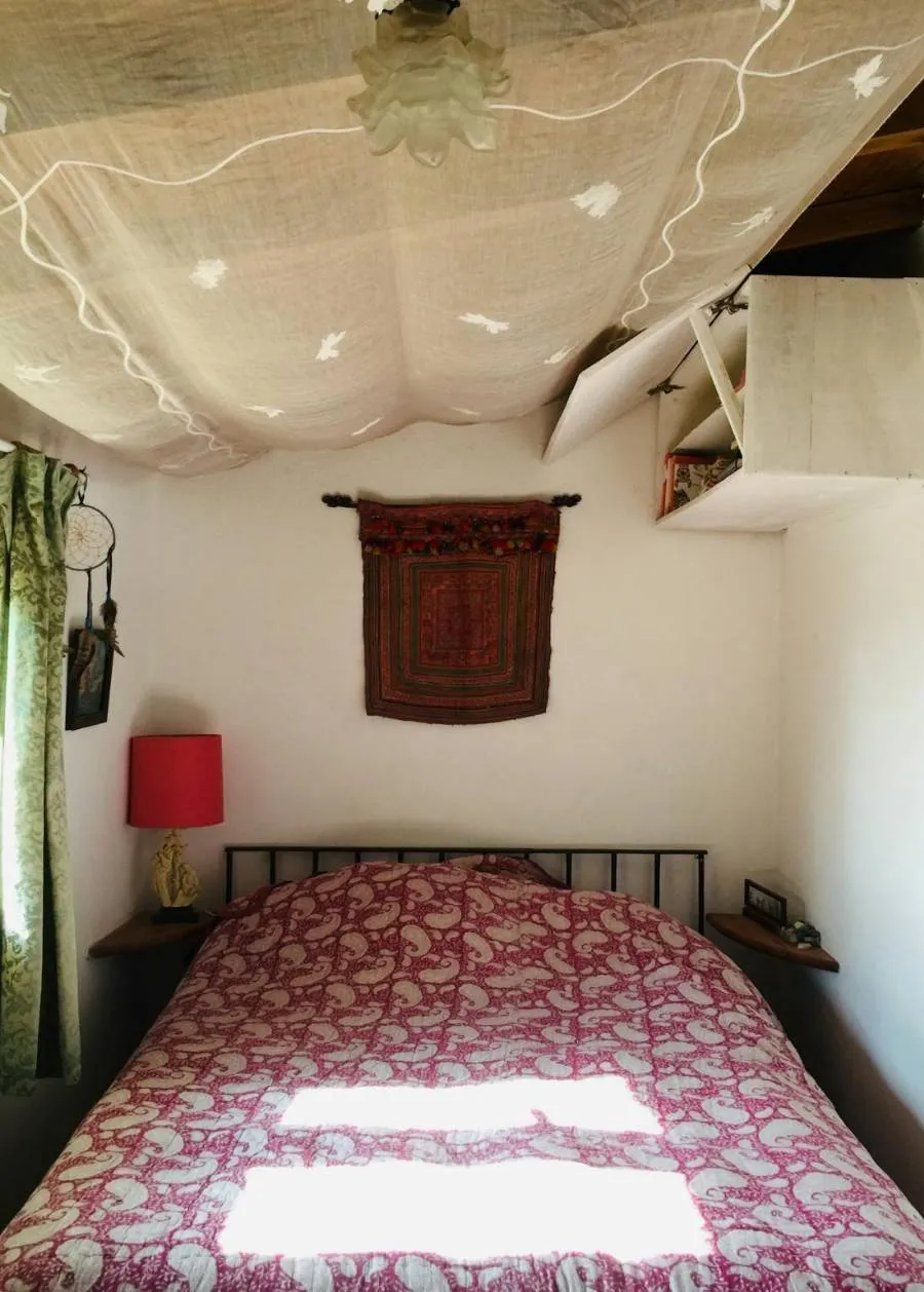 A light printed cotton dohar on a bed