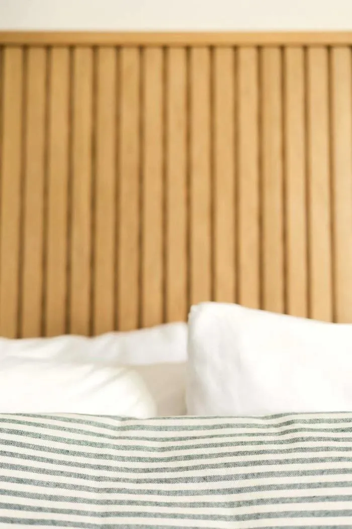 A bed dressed in light summer-weight cotton
