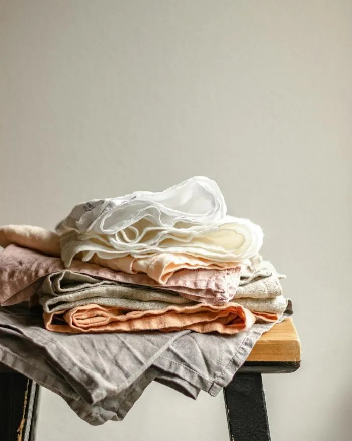 A stack of folded linen napkins